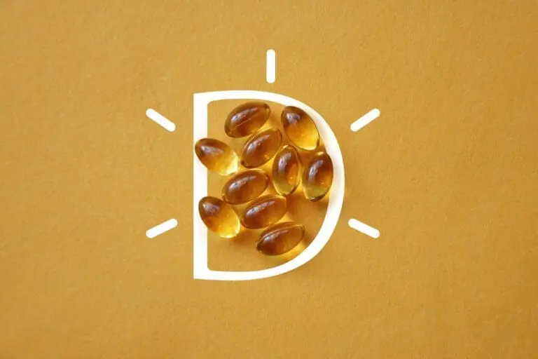 vitamin D capsules on a yellow background