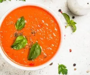 bowl of tomato soup with basil
