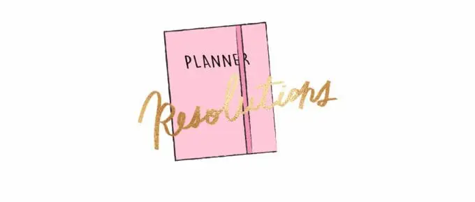 pink planner with gold lettering that spells Resolutions