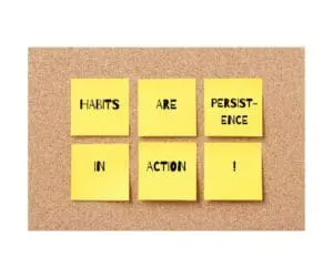 bulletin board with yellow sticky notes