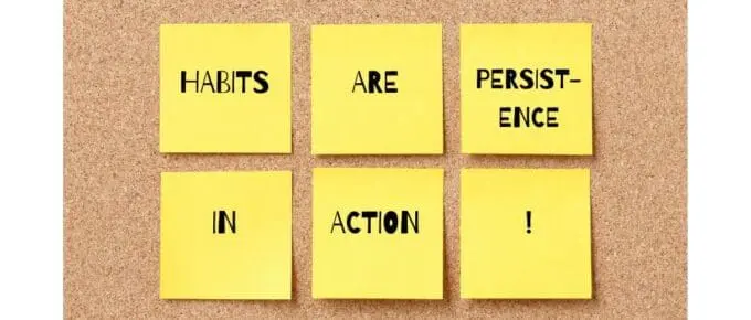 bulletin board with yellow sticky notes