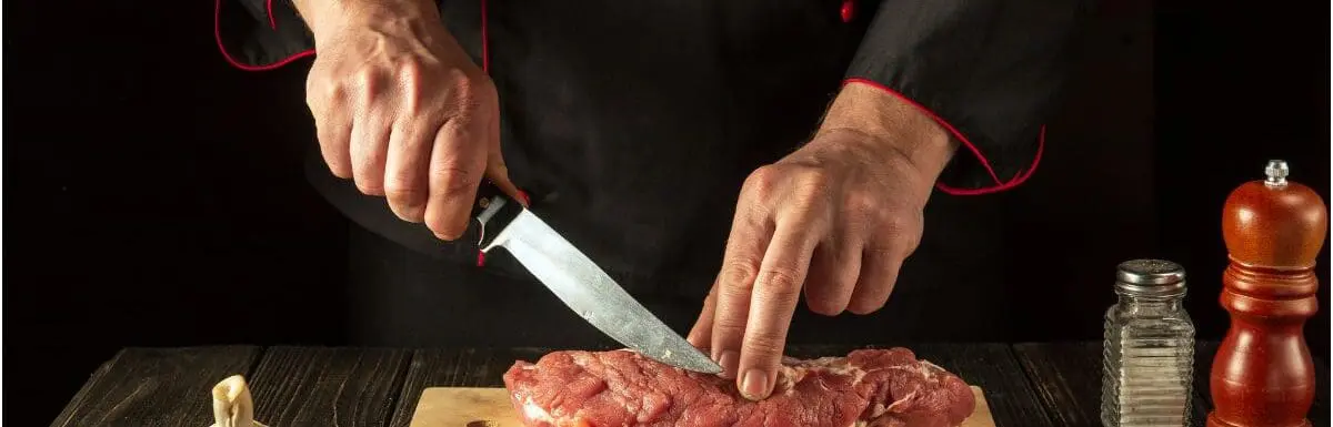 piece of meat being cut