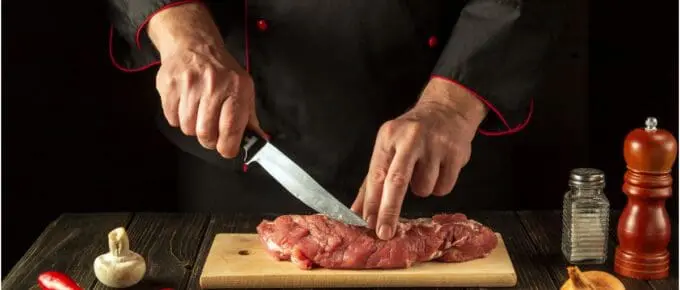 piece of meat being cut