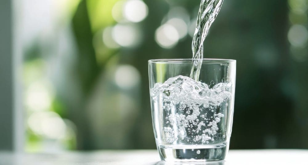Pouring water into a glass