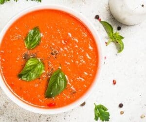 bowl of tomato soup with basil