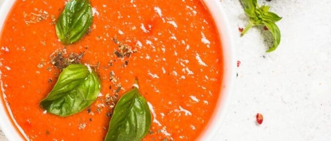 bowl of tomato soup with basil