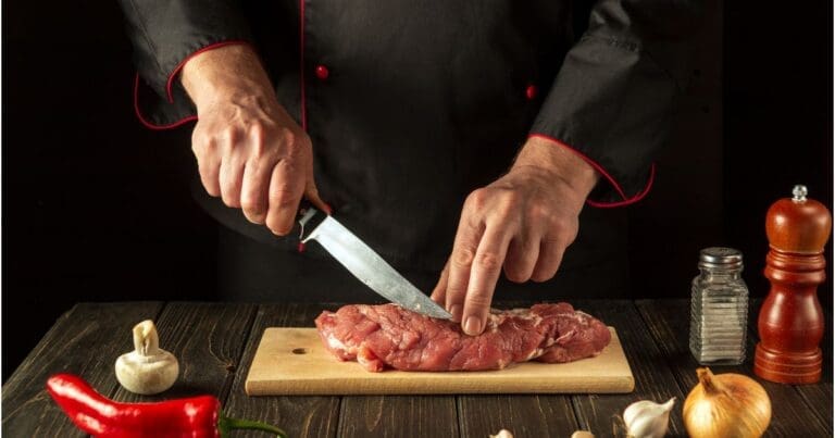 piece of meat being cut